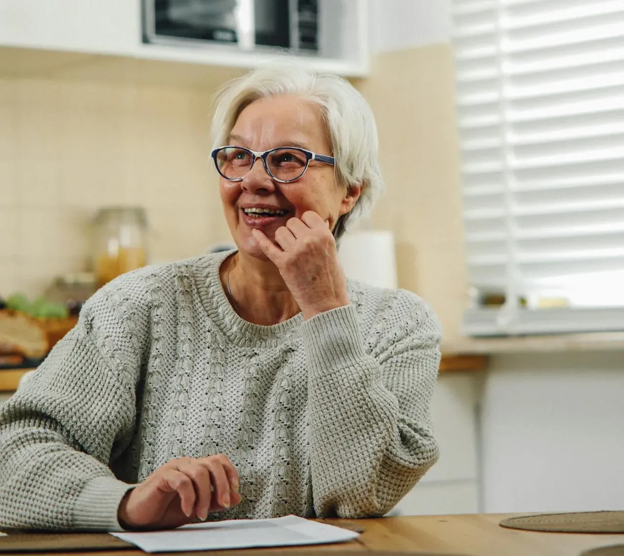 Woman in Gray Sweater Wearing Eyeglasses